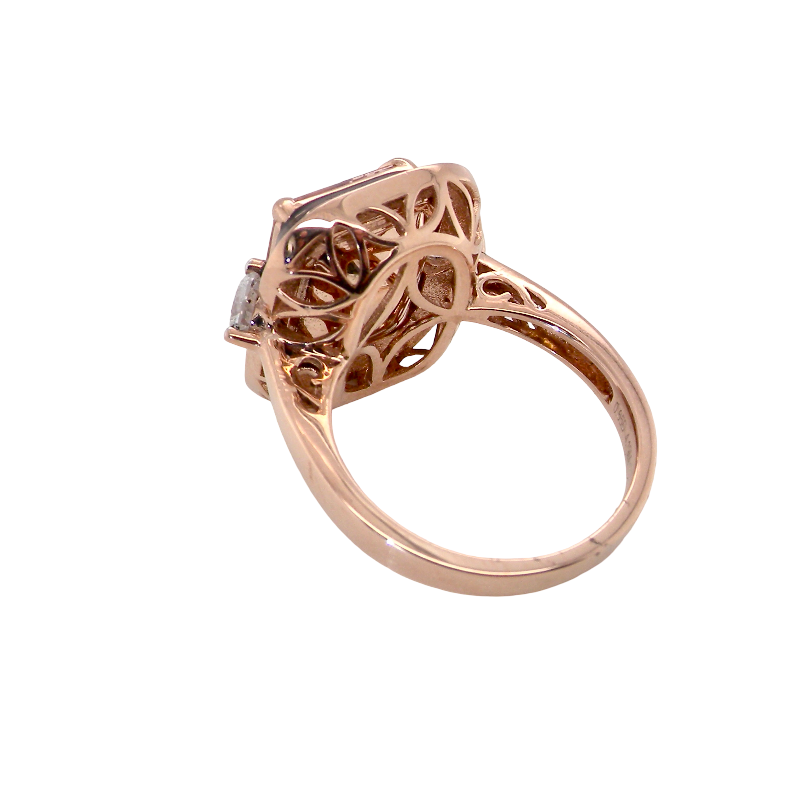 A rose gold filigree ring with a square-cut clear gemstone, shown from a side angle on a plain white background.