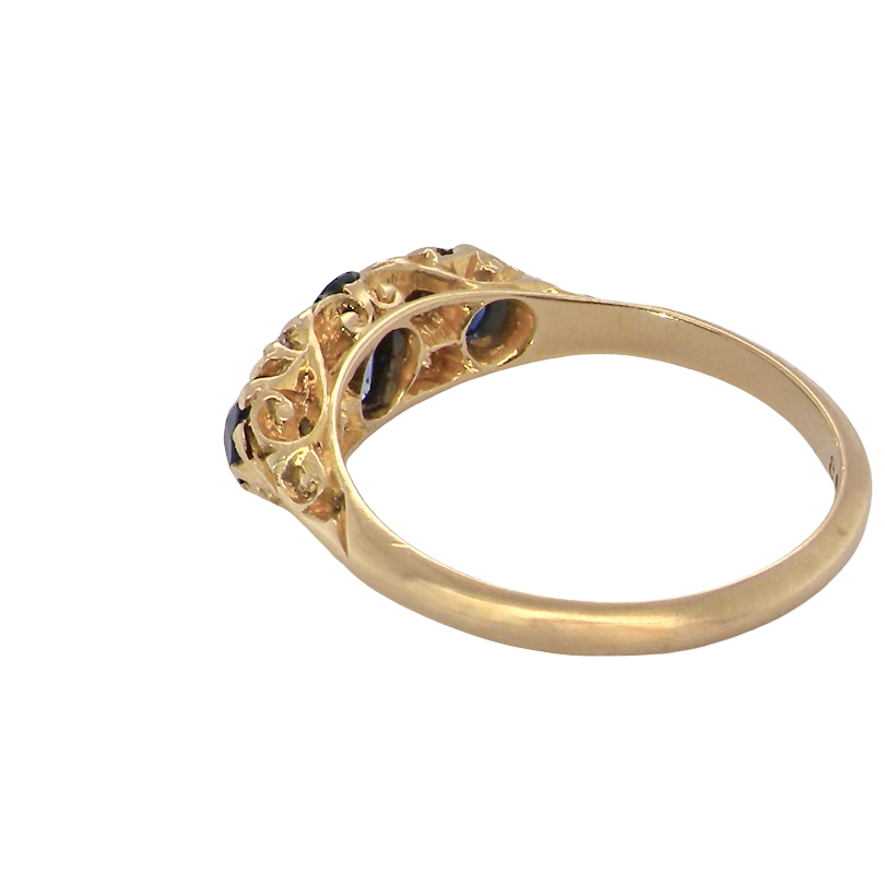 rear A beautiful Edwardian sapphire and diamond ring, dating to 1907, crafted in 18 carat gold with a traditional hand-carved boat-shaped setting.