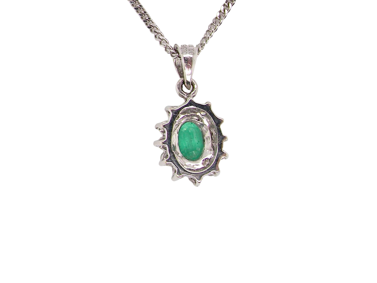 rear A beautiful traditional cluster pendant featuring a vibrant oval-cut emerald