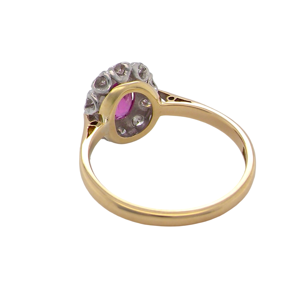rear A beautiful vintage cluster ring showcasing a vivid pink sapphire centre stone, measuring approximately 6.6 × 4.3 mm(estimated 0.65 carats).
