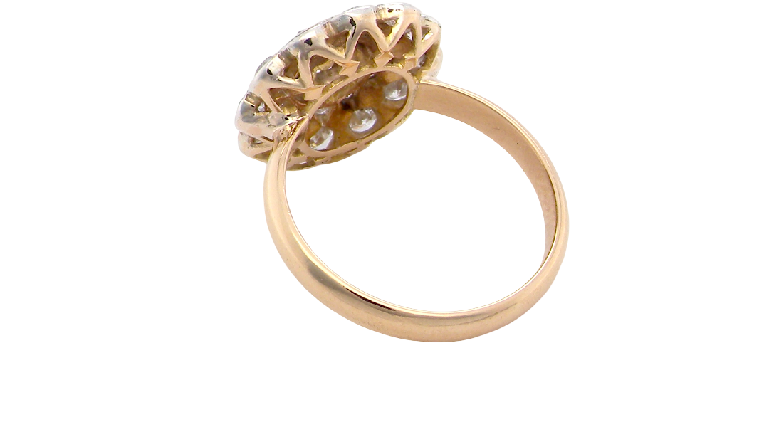 rear A beautiful vintage diamond cluster ring. Know as a target cluster, the diamonds are old brilliant cut. Centre diamond 3.8mm (0.20 carats) . 