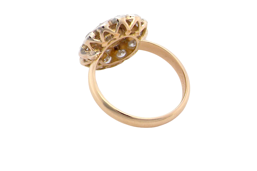 rear A beautiful vintage diamond cluster ring. Know as a target cluster, the diamonds are old brilliant cut. Centre diamond 3.8mm (0.20 carats) . 