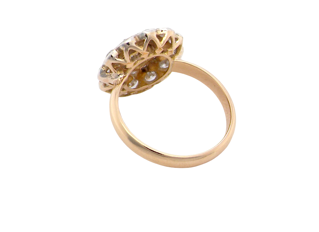 rear A beautiful vintage diamond cluster ring. Know as a target cluster, the diamonds are old brilliant cut. Centre diamond 3.8mm (0.20 carats) . 