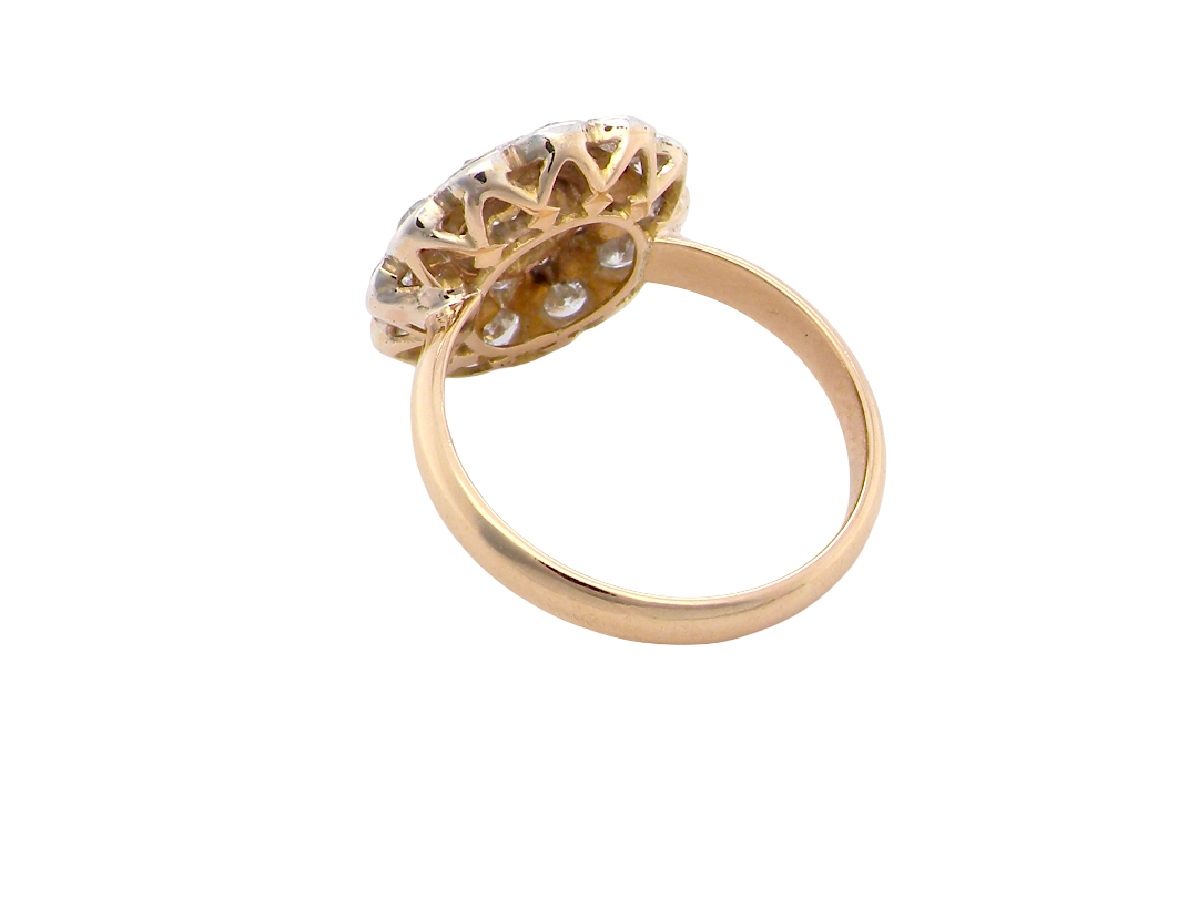 rear A beautiful vintage diamond cluster ring. Know as a target cluster, the diamonds are old brilliant cut. Centre diamond 3.8mm (0.20 carats) . 