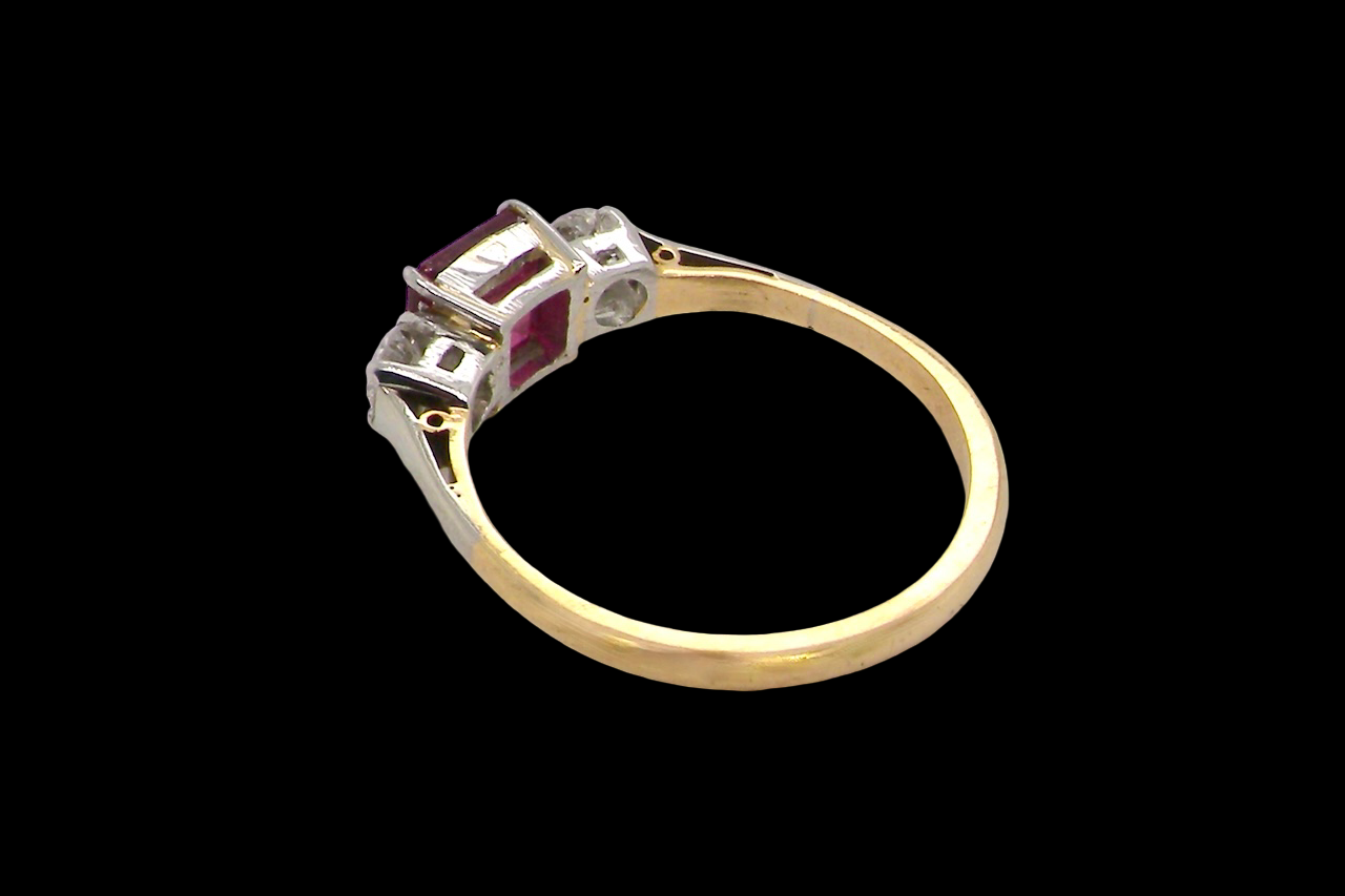 Gold ring with gemstones on a black background