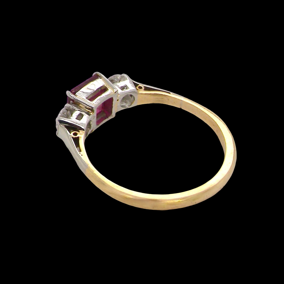 Gold ring with gemstones on a black background