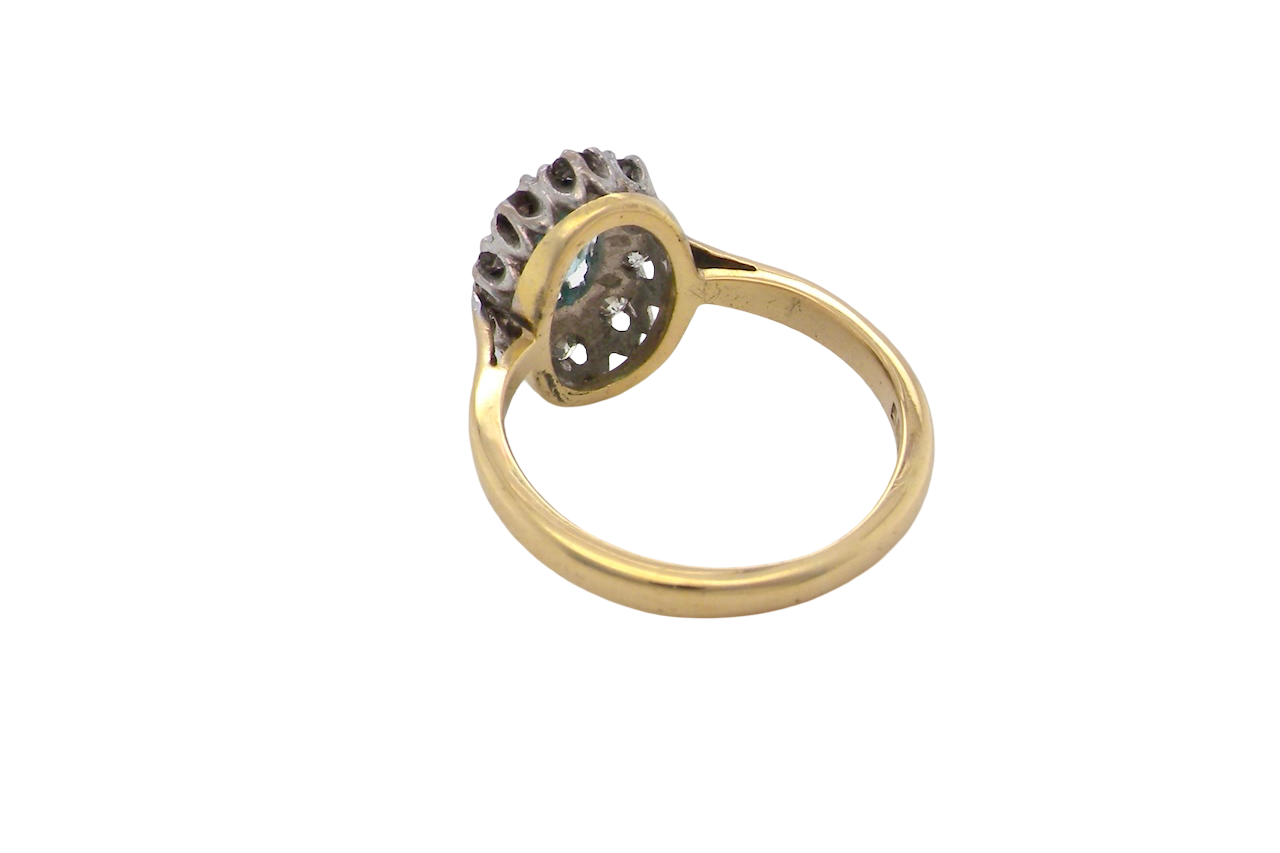 rear A cluster ring set with a natural blue zircon centre stone, 7.5x5mm, vibrant aquamarine colour. 