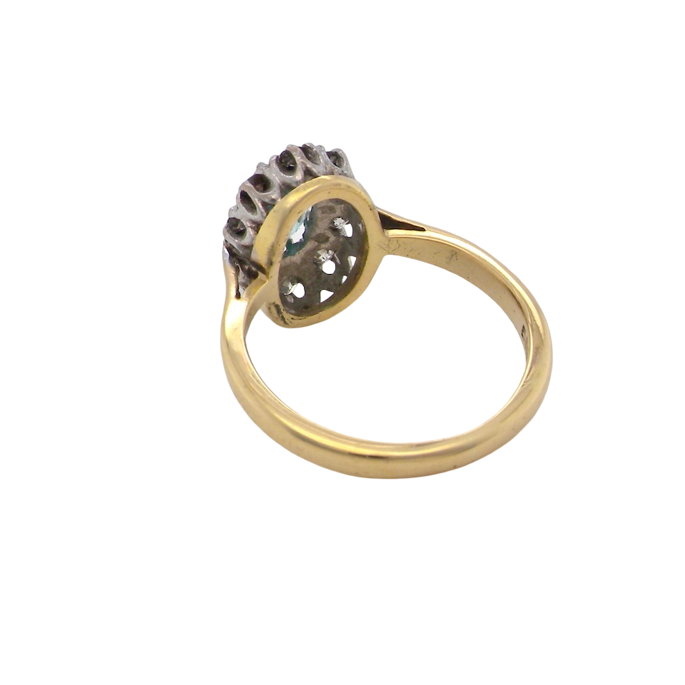 rear A cluster ring set with a natural blue zircon centre stone, 7.5x5mm, vibrant aquamarine colour. 
