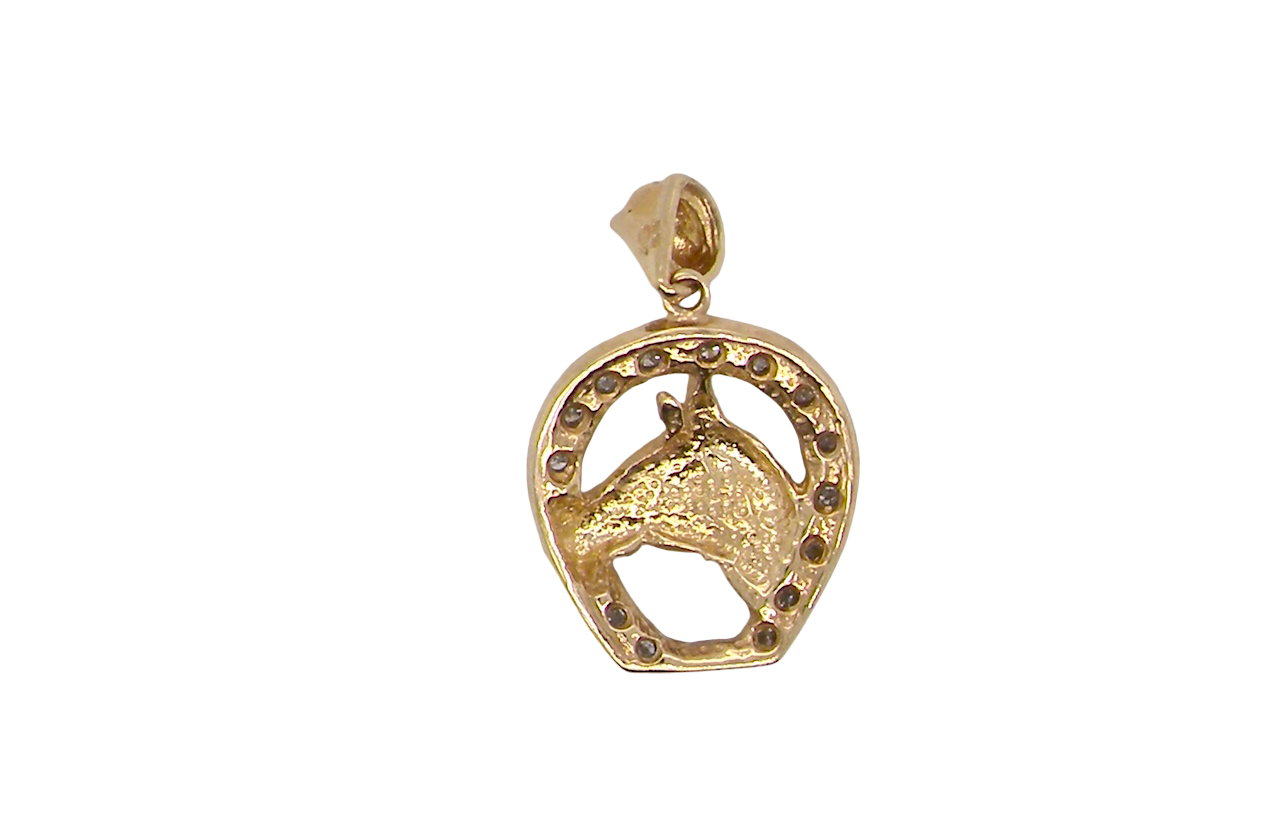 Gold pendant with horse design on a white background