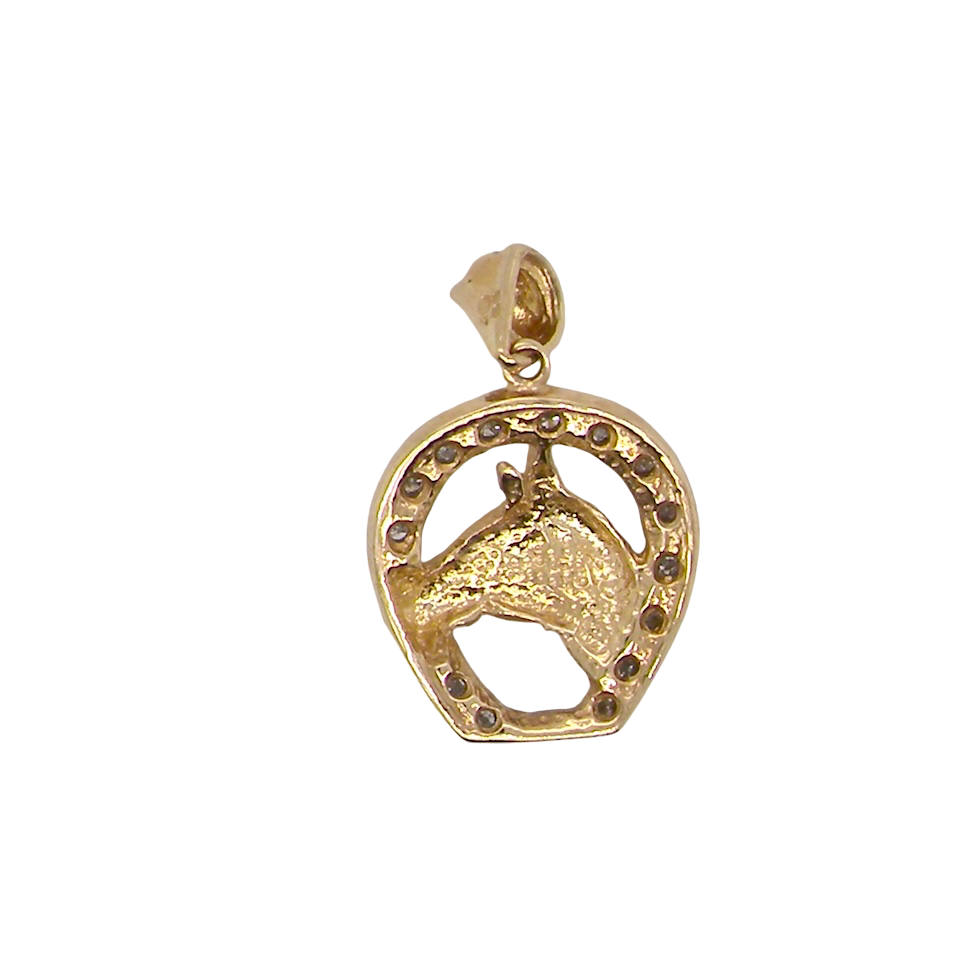 Gold pendant with horse design on a white background