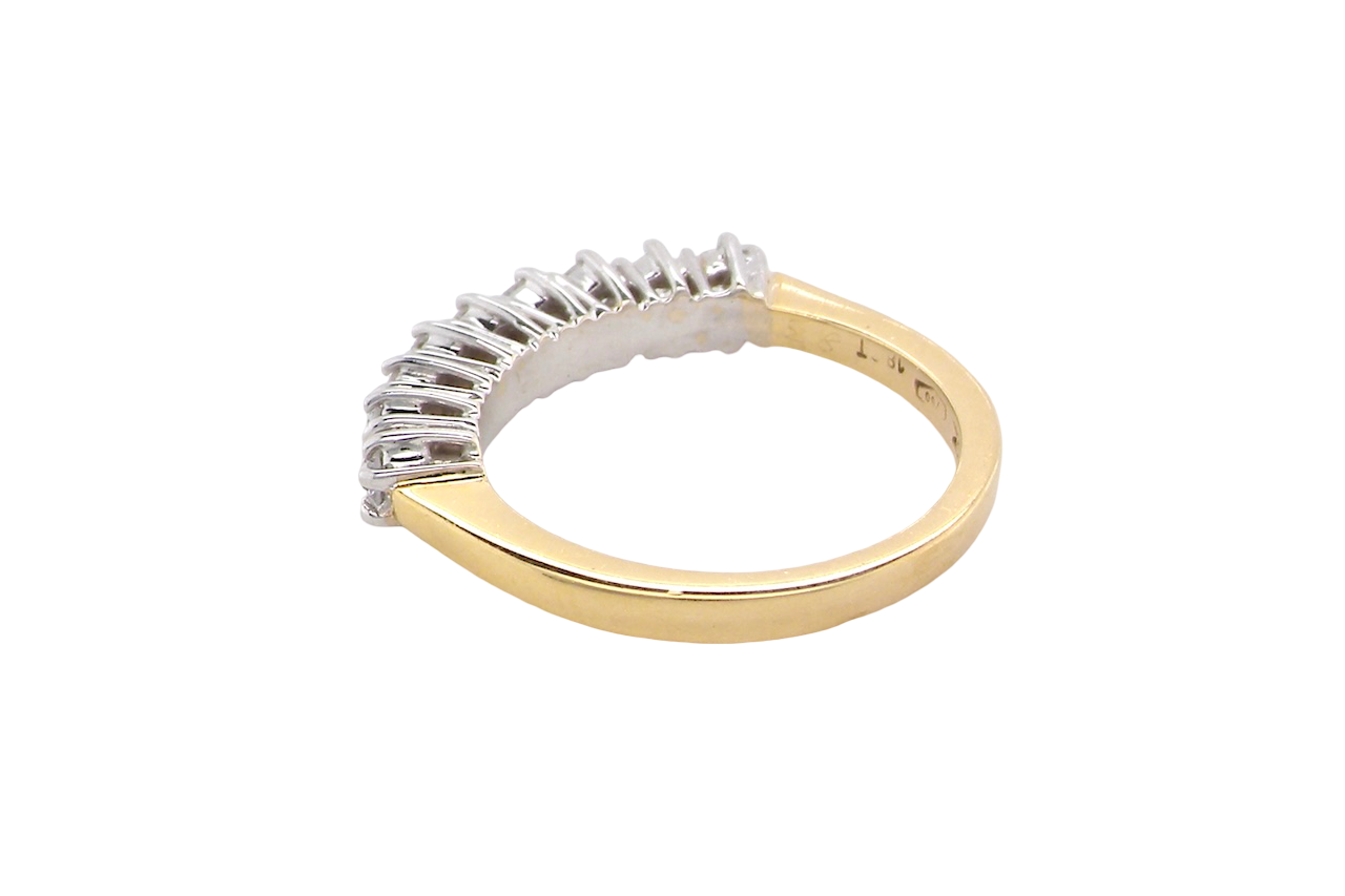 rear A fine 18 carat gold half hoop eternity ring, beautifully set with an array of seven brilliant-cut white diamonds.