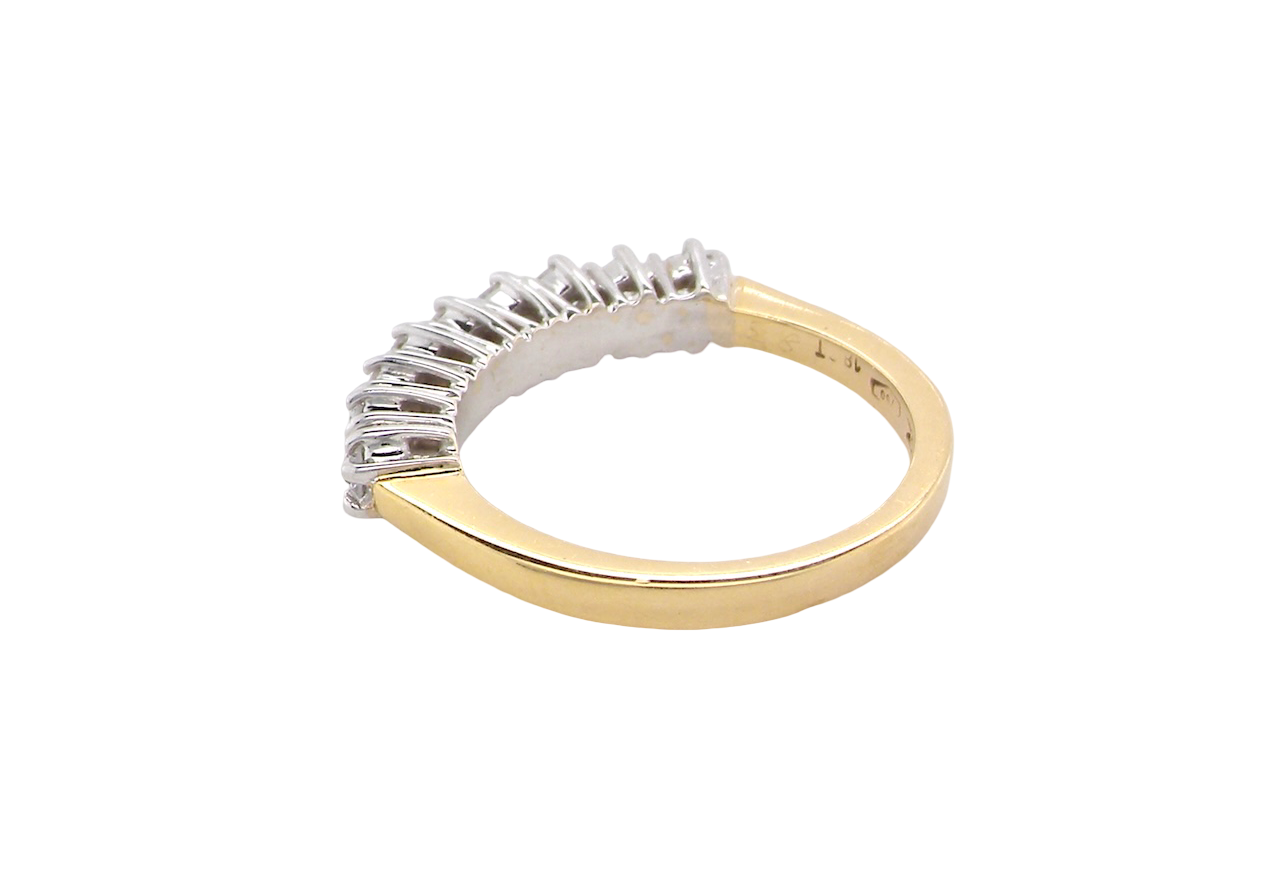 rear A fine 18 carat gold half hoop eternity ring, beautifully set with an array of seven brilliant-cut white diamonds.