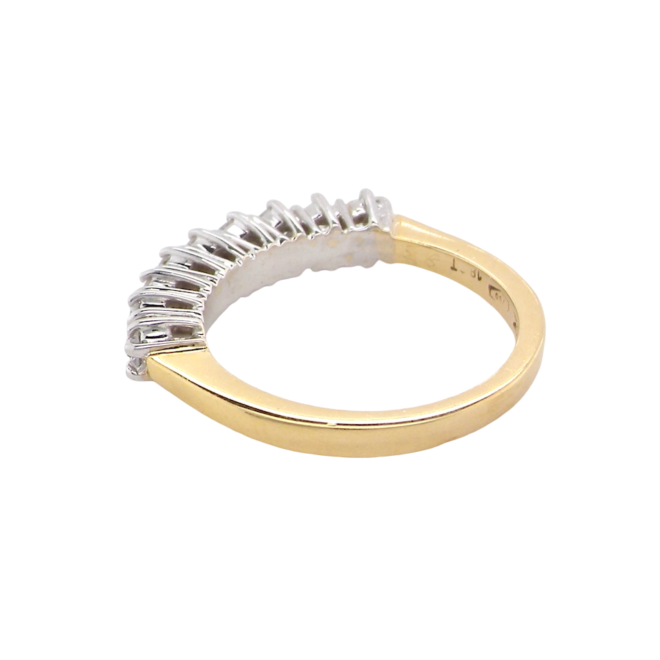 rear A fine 18 carat gold half hoop eternity ring, beautifully set with an array of seven brilliant-cut white diamonds.