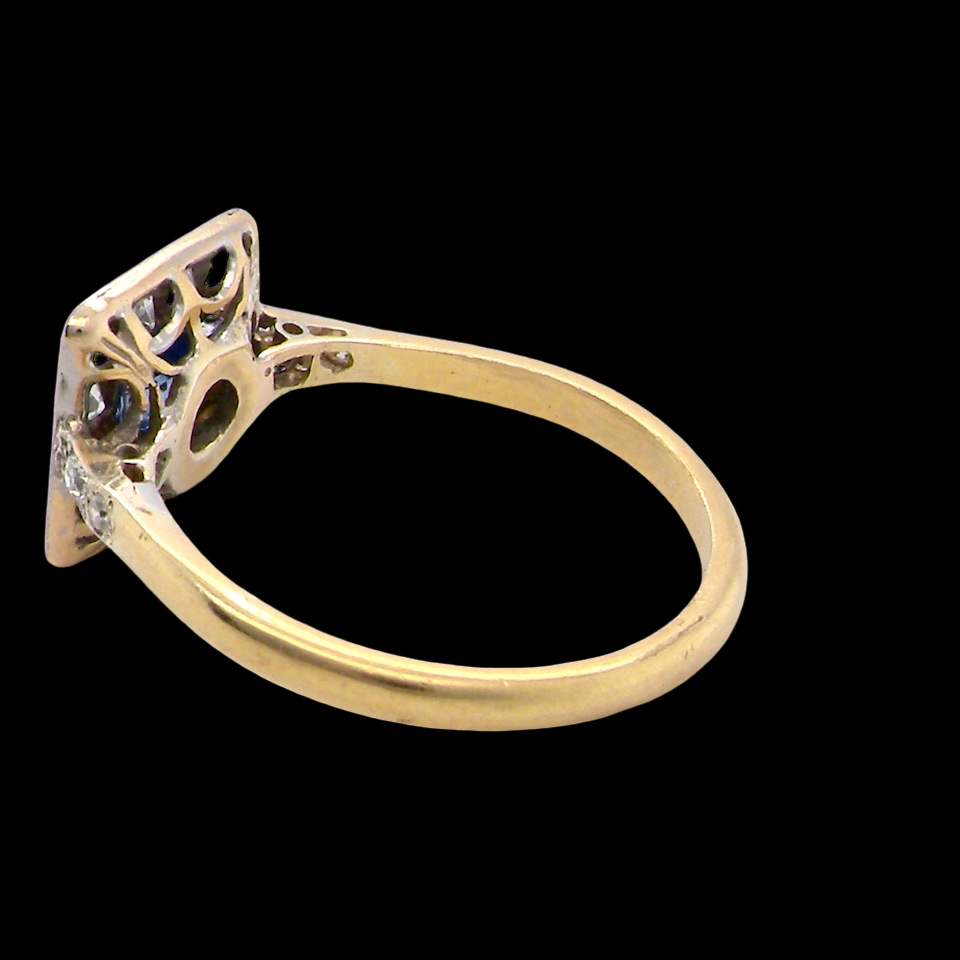 rear A fine Art Deco cluster ring. The centre stone a square sapphire 5x5mm (est 0.50 carats) in a mille grain setting.
