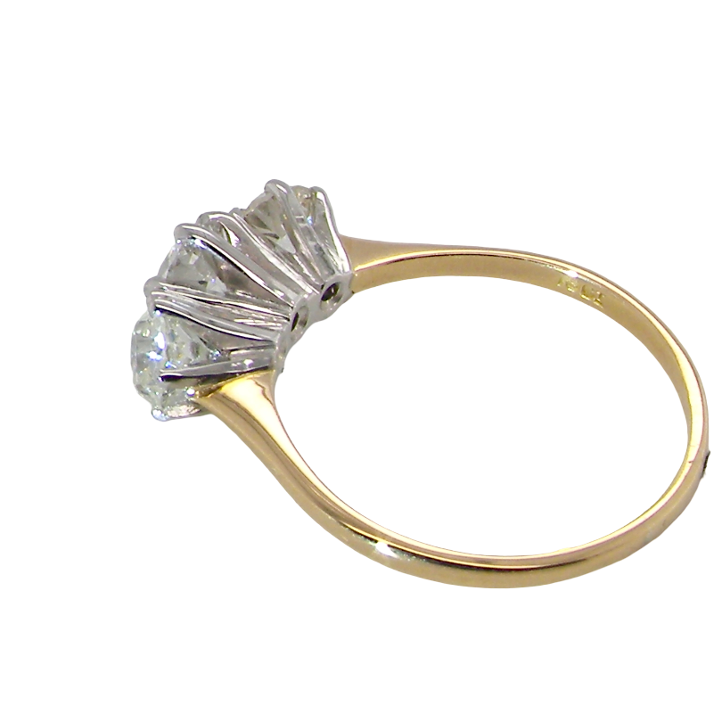 A yellow gold ring with a multi-stone diamond cluster setting, shown on a plain white background.