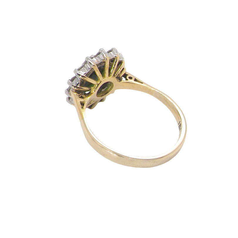 rear A fine and impressive vintage cluster ring, centred with a striking oval-cut deep dark green tourmaline, measuring 9 x 7mm and estimated to weigh approximately 2.00 carats.