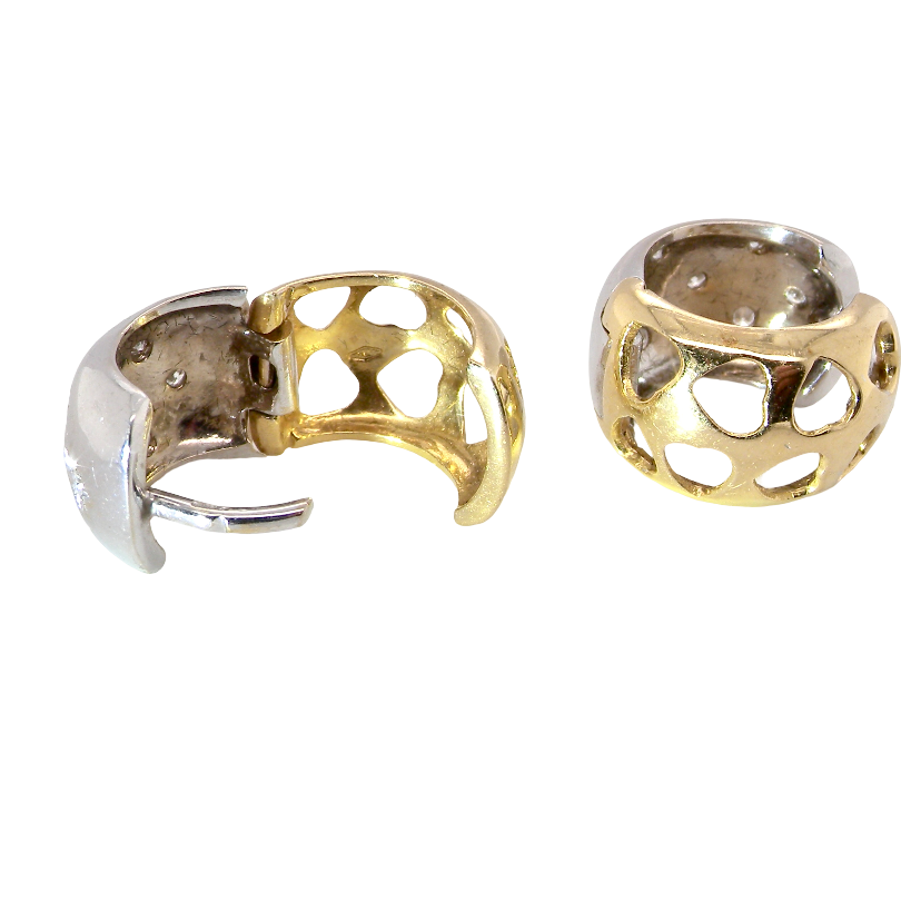 rear A fine pair of cuff style hoop earrings. The front part is 18 carat white gold * set with seven small white diamonds,