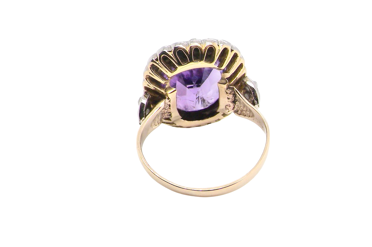 rear A fine vintage ring. Features to the centre a large cushion shaped amethyst, 13x10mm, rim setting.