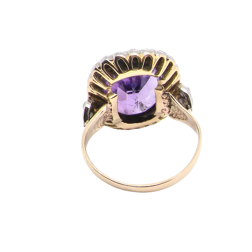 rear A fine vintage ring. Features to the centre a large cushion shaped amethyst, 13x10mm, rim setting.