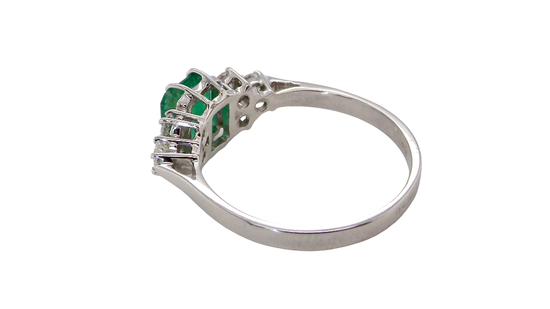 rear A fine white gold* ring that features a rectangular emerald centre stone, measures 6x6.5mm (est one carat), mid to dark green hue, natural inclusions as with most emeralds.