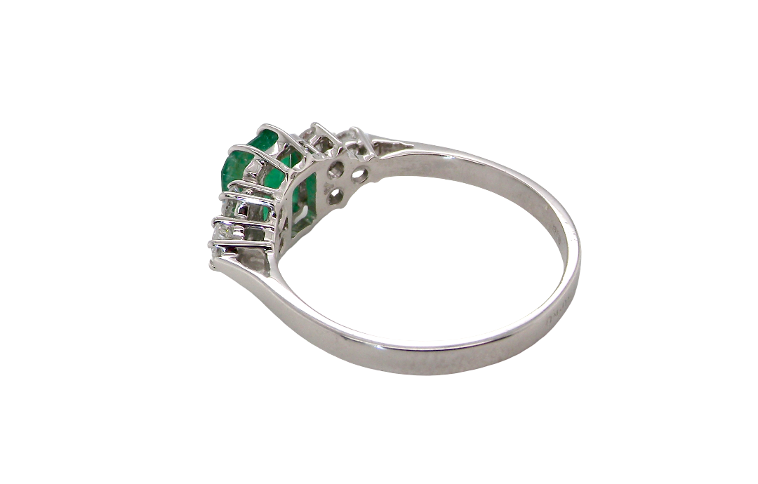 rear A fine white gold* ring that features a rectangular emerald centre stone, measures 6x6.5mm (est one carat), mid to dark green hue, natural inclusions as with most emeralds.