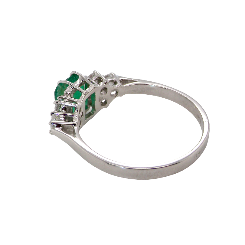rear A fine white gold* ring that features a rectangular emerald centre stone, measures 6x6.5mm (est one carat), mid to dark green hue, natural inclusions as with most emeralds.