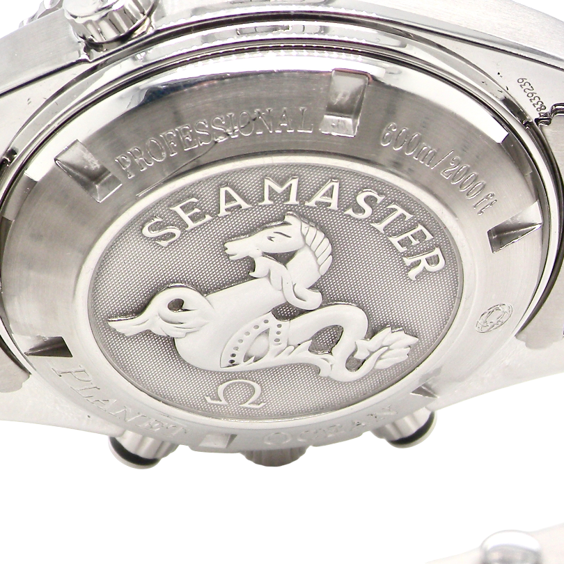 Close-up of the back case of a stainless steel Seamaster watch, showing the engraved Seamaster logo and text on a white background.