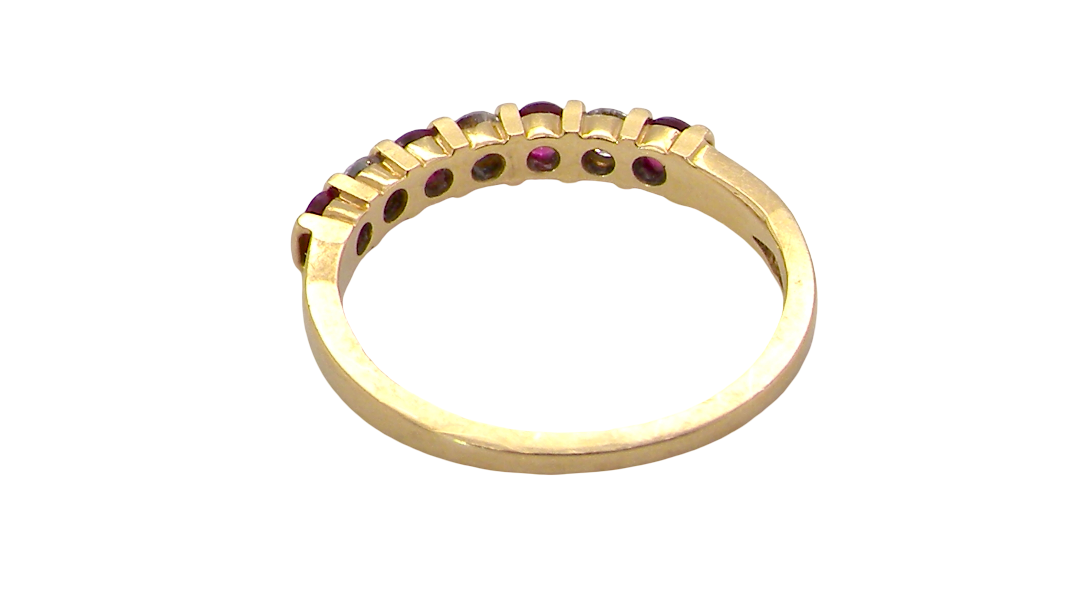 rear A half hoop 18 carat yellow gold eternity ring. Set with four bright red rubies, each 2.6mm (total carat weight 0.28 est)