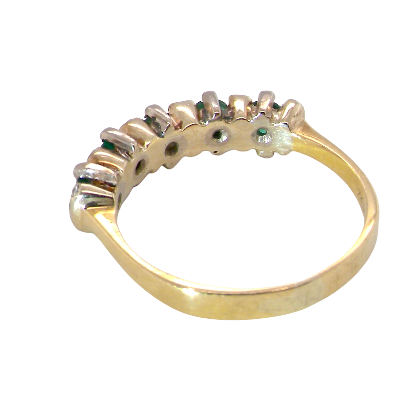 rear A half hoop ring, stamped 750 (testing as 18 carat gold)
Set with alternate gemstones, five bright green emeralds