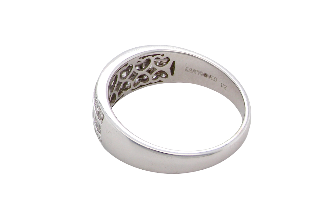 rear A lovely 18 carat white gold half hoop ring. Set with a middle row of nine bright white brilliant cut diamonds, graduate from 2.2mm to 2.6mm. The top and bottom rows are also set with small diamonds.