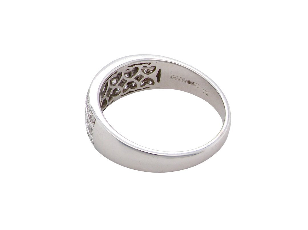 rear A lovely 18 carat white gold half hoop ring. Set with a middle row of nine bright white brilliant cut diamonds, graduate from 2.2mm to 2.6mm. The top and bottom rows are also set with small diamonds.