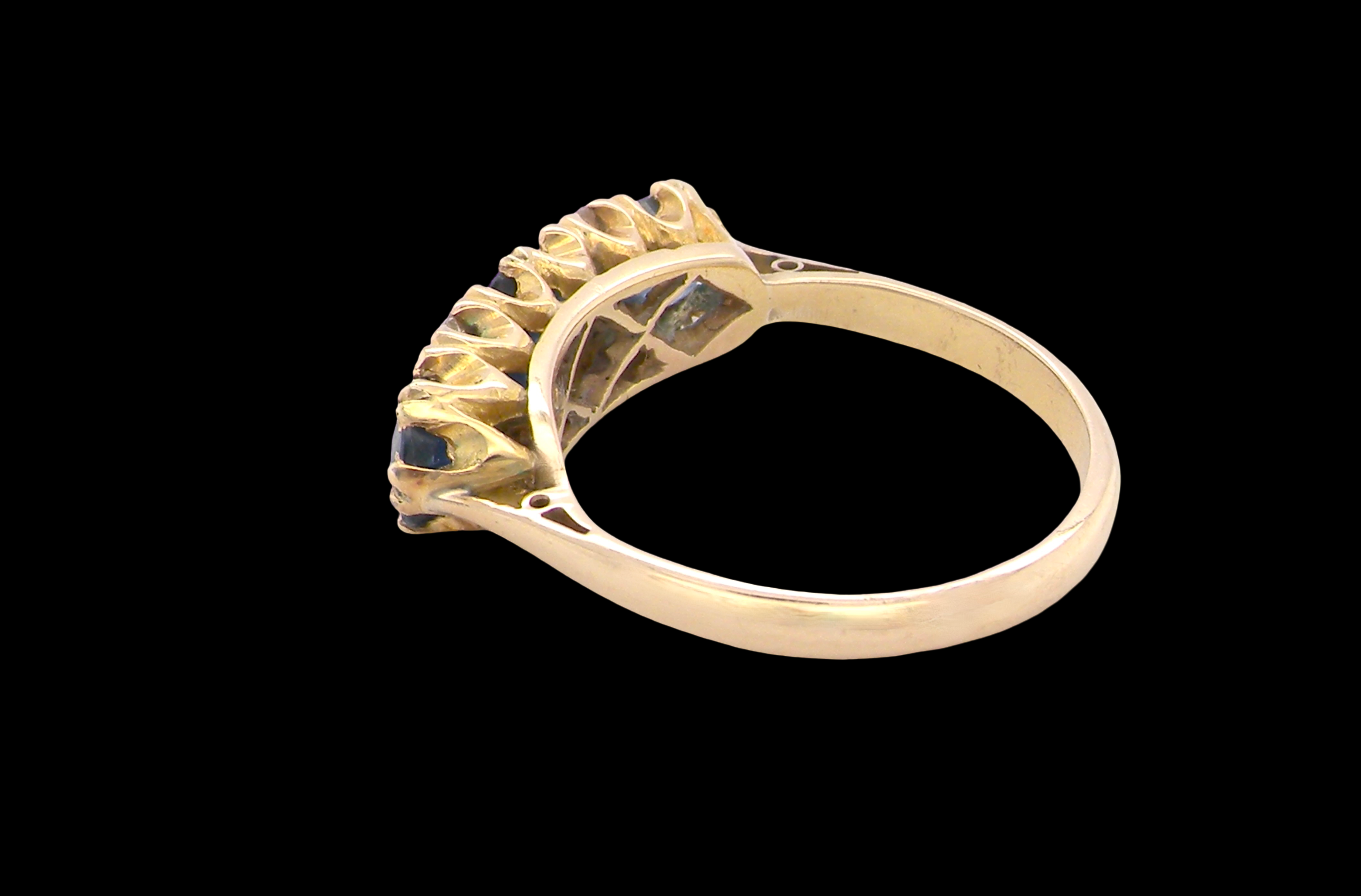 rear A lovely ring from the turn of the 19th century. Set with impressive round sapphires,