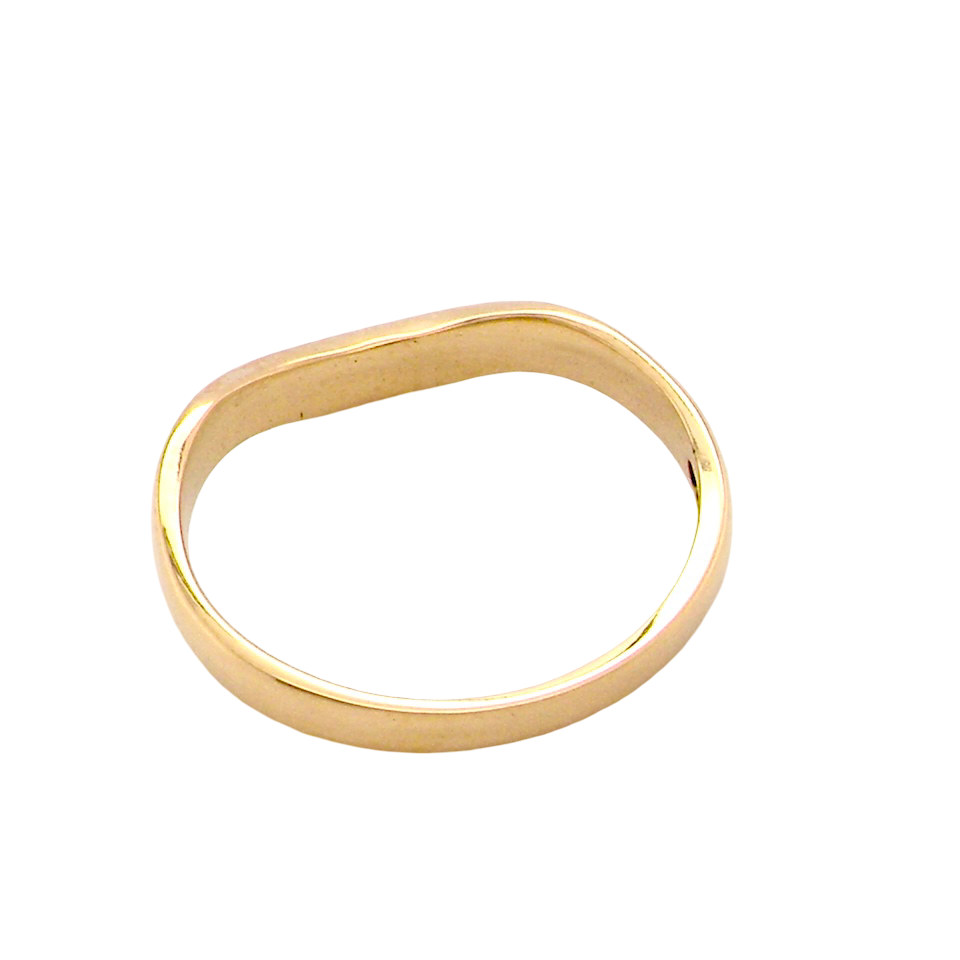 rear A narrow 18 carat yellow gold wedding ring. This has a U shape which makes the placing of a cluster or even a solitaire engagement ring that much easier to place against as it will sit with the 'U'