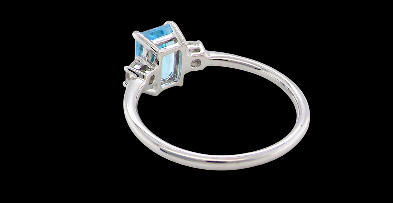 rear A 9 carat white gold three stone ring. This ring is from our Heirloom Collection. This is when we take a stone from a pre-owned ring that is worn out, and reset it into a brand new setting.