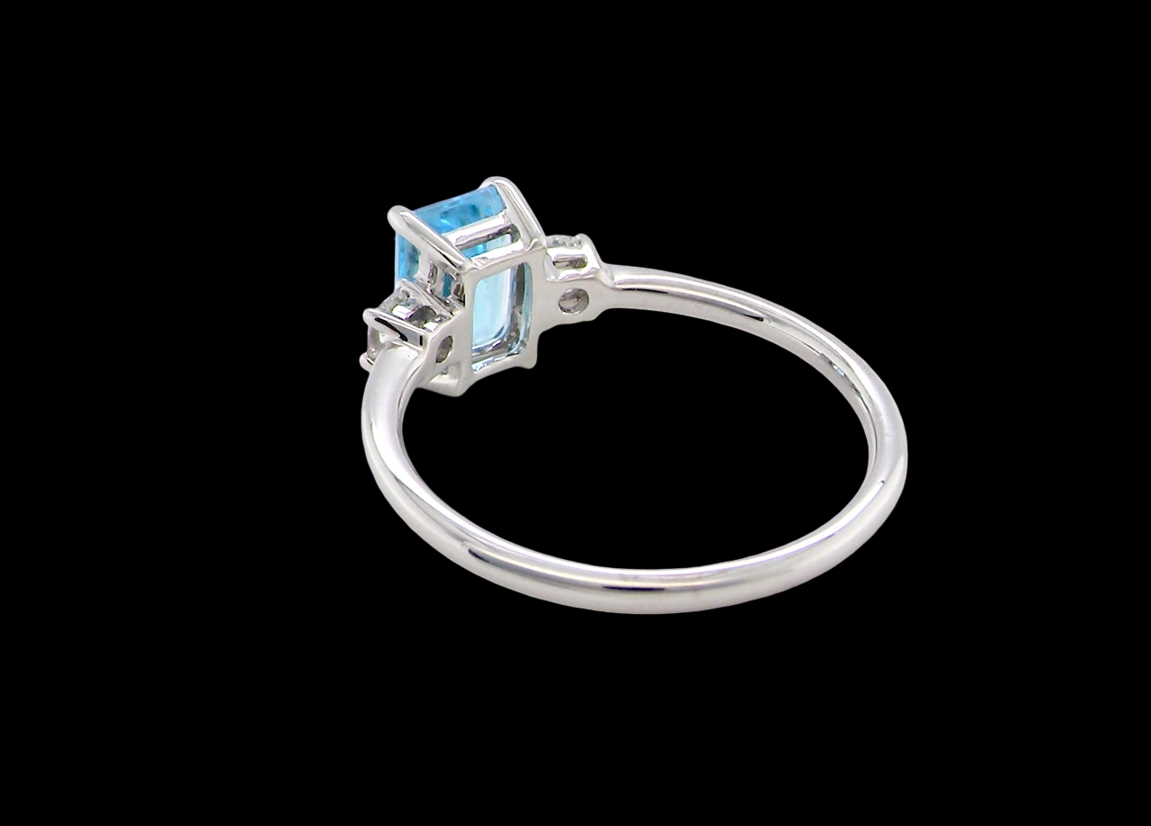 rear A 9 carat white gold three stone ring. This ring is from our Heirloom Collection. This is when we take a stone from a pre-owned ring that is worn out, and reset it into a brand new setting.