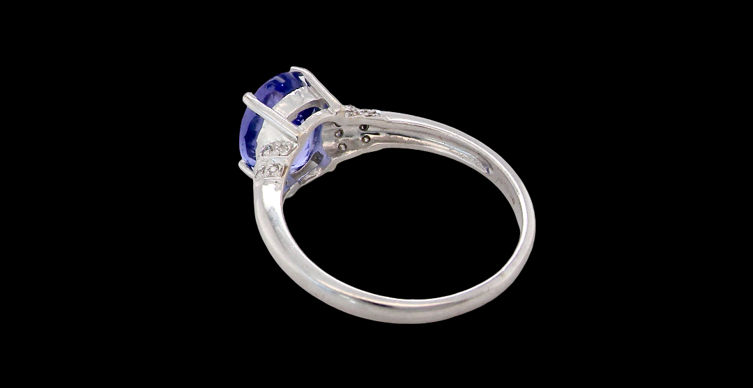 rear A pretty 18 carat white gold ring that features an AAA Tanzanite gem stone. Displaying tones of purple and lilac the stone is oval cut at around 8x6mm (1.47 carat approx)