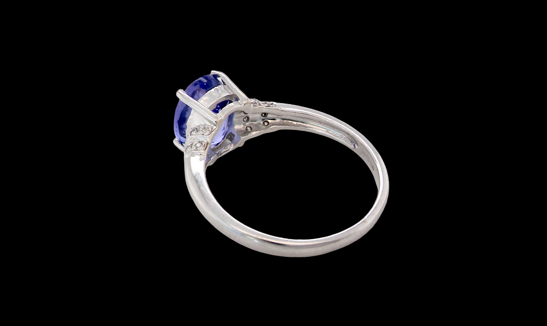 rear A pretty 18 carat white gold ring that features an AAA Tanzanite gem stone. Displaying tones of purple and lilac the stone is oval cut at around 8x6mm (1.47 carat approx)