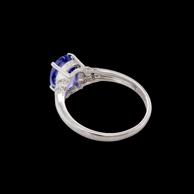 rear A pretty 18 carat white gold ring that features an AAA Tanzanite gem stone. Displaying tones of purple and lilac the stone is oval cut at around 8x6mm (1.47 carat approx)