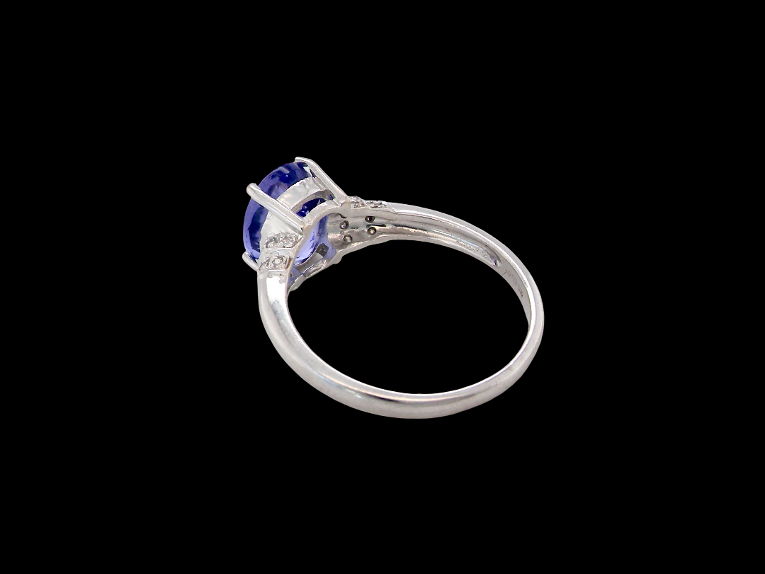 rear A pretty 18 carat white gold ring that features an AAA Tanzanite gem stone. Displaying tones of purple and lilac the stone is oval cut at around 8x6mm (1.47 carat approx)