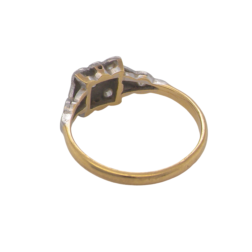 rear A pretty diamond cluster ring from the early part of the 20th century. A square head that has within it small white diamonds, measures 8x8mm, fancy shoulders also set with tiny diamonds.