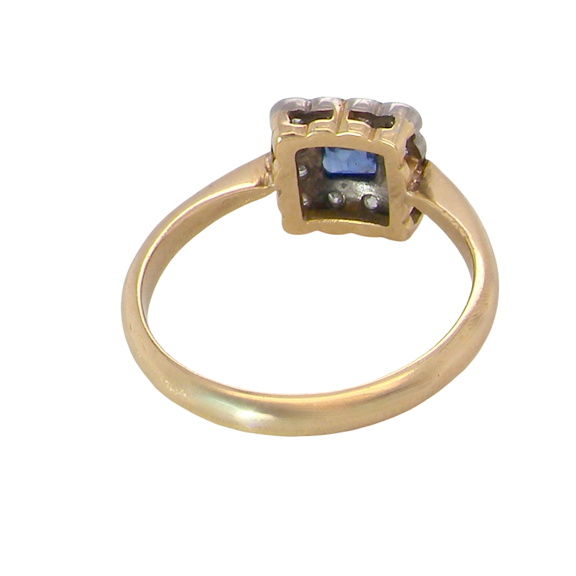 rear A pretty square cluster ring. Features to the centre a cornflower blue square sapphire, 4x4mm (est 0.30 carats) mille grain set.
Complimented by a halo of twelve x 1.5 mm single cut white diamonds