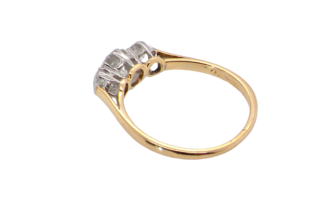 rear A pretty three stone trilogy ring that features three brilliant cut white diamonds.
Centre diamond, 5mm (est 0.50 carats) each side a 4mm diamond (est 0.25 carats). Colour G-h, clarity Si. Platinum rim style setting, head measures 12.7x5.3mm, depth 5.3mm, weight 2.4grams.