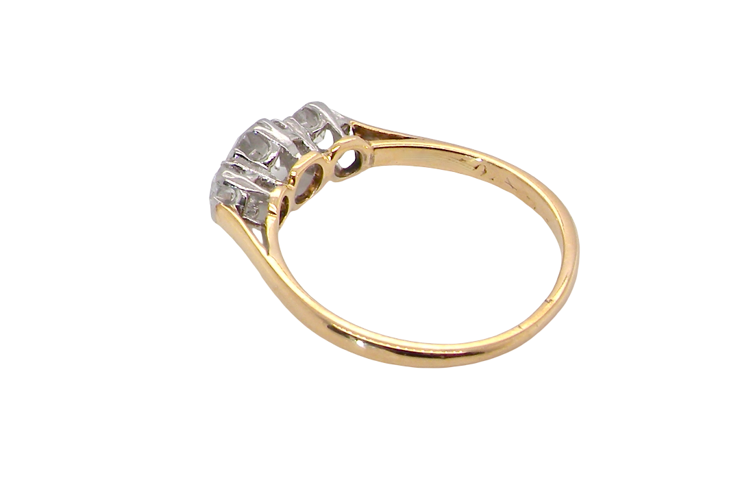 rear A pretty three stone trilogy ring that features three brilliant cut white diamonds.
Centre diamond, 5mm (est 0.50 carats) each side a 4mm diamond (est 0.25 carats). Colour G-h, clarity Si. Platinum rim style setting, head measures 12.7x5.3mm, depth 5.3mm, weight 2.4grams.