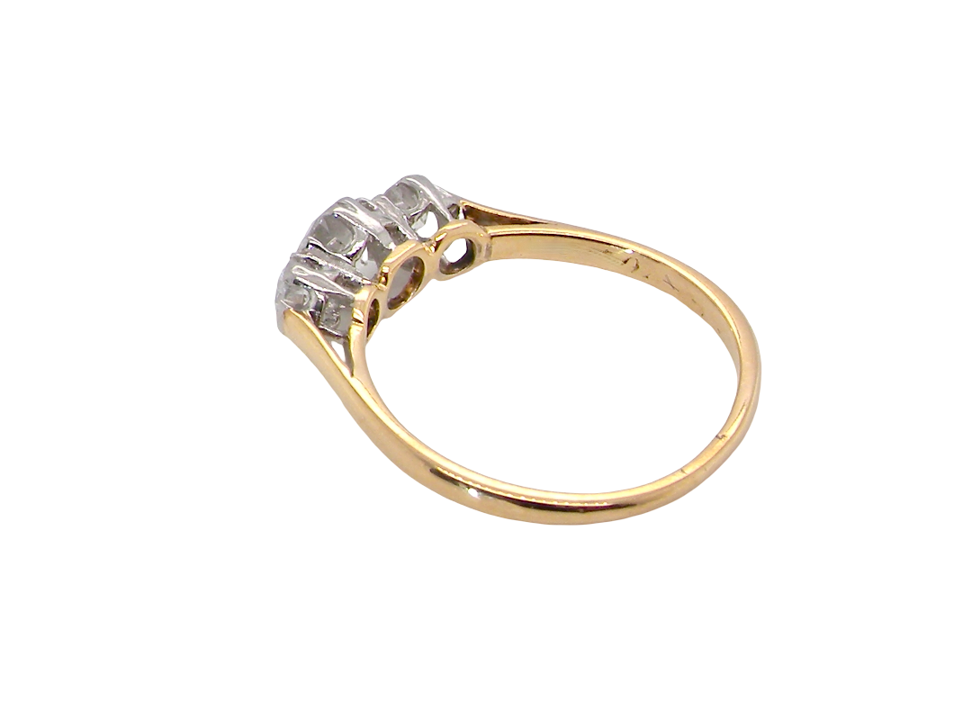 rear A pretty three stone trilogy ring that features three brilliant cut white diamonds.
Centre diamond, 5mm (est 0.50 carats) each side a 4mm diamond (est 0.25 carats). Colour G-h, clarity Si. Platinum rim style setting, head measures 12.7x5.3mm, depth 5.3mm, weight 2.4grams.