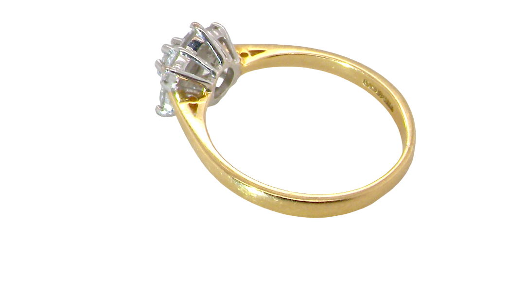 rear A small cluster ring set with seven bright white brilliant cut white diamonds.
Head measures 8.5mm, each diamond measures 2.8mm (total 0.50 carats