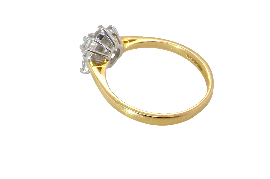 rear A small cluster ring set with seven bright white brilliant cut white diamonds.
Head measures 8.5mm, each diamond measures 2.8mm (total 0.50 carats
