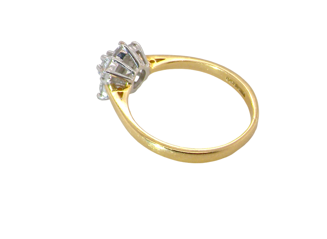 rear A small cluster ring set with seven bright white brilliant cut white diamonds.
Head measures 8.5mm, each diamond measures 2.8mm (total 0.50 carats