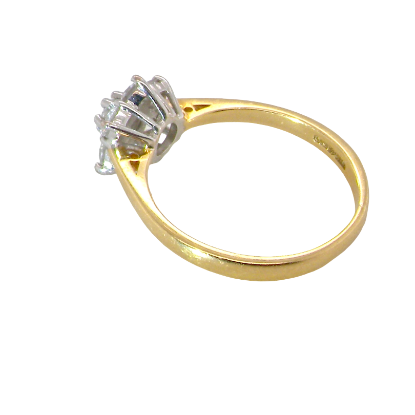 rear A small cluster ring set with seven bright white brilliant cut white diamonds.
Head measures 8.5mm, each diamond measures 2.8mm (total 0.50 carats