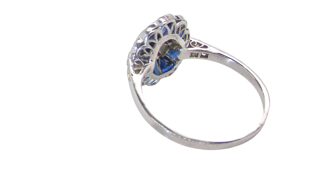 A highly unusual Art Deco cluster ring featuring a distinctive fan-shaped design.