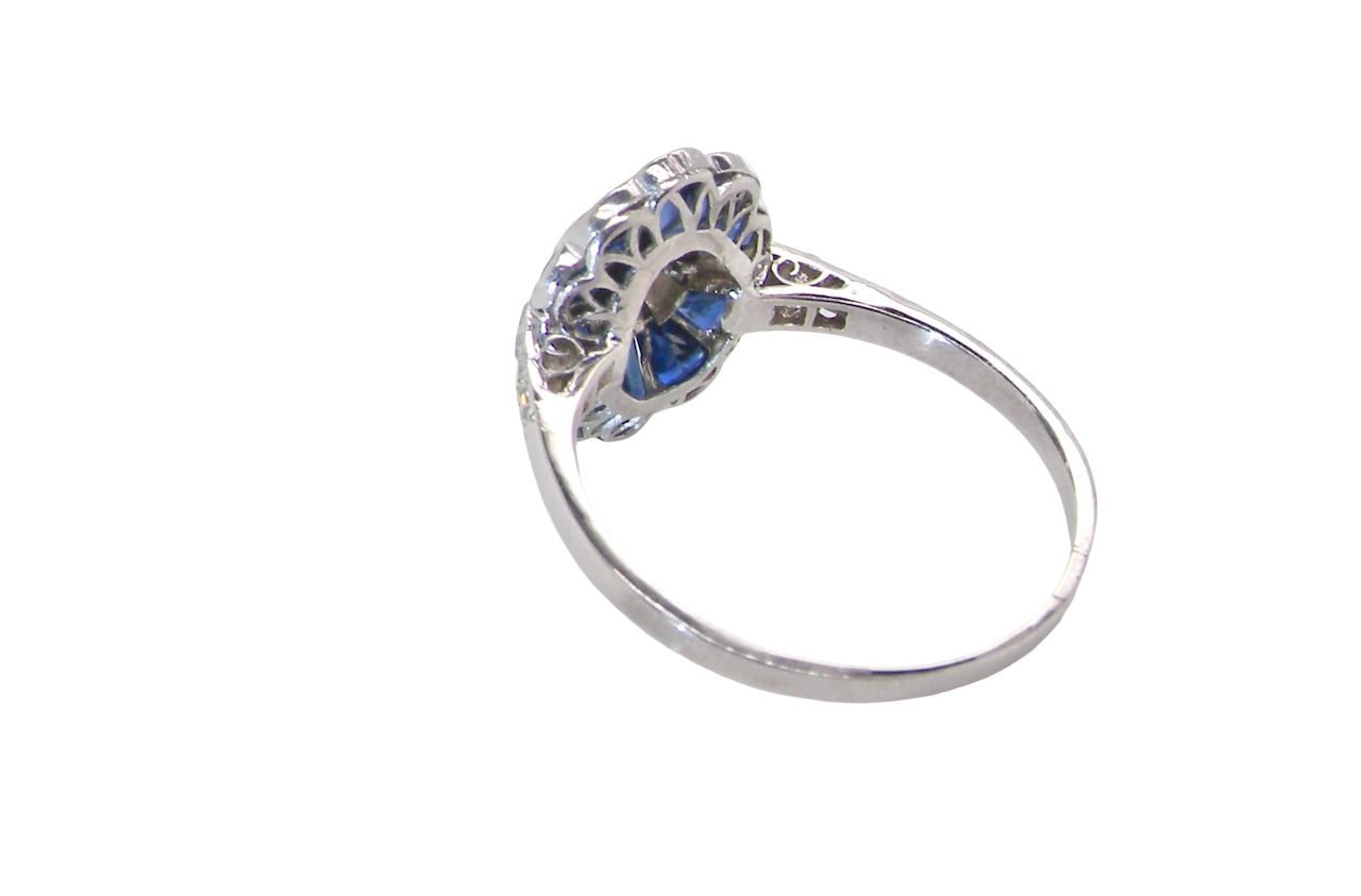 A highly unusual Art Deco cluster ring featuring a distinctive fan-shaped design.